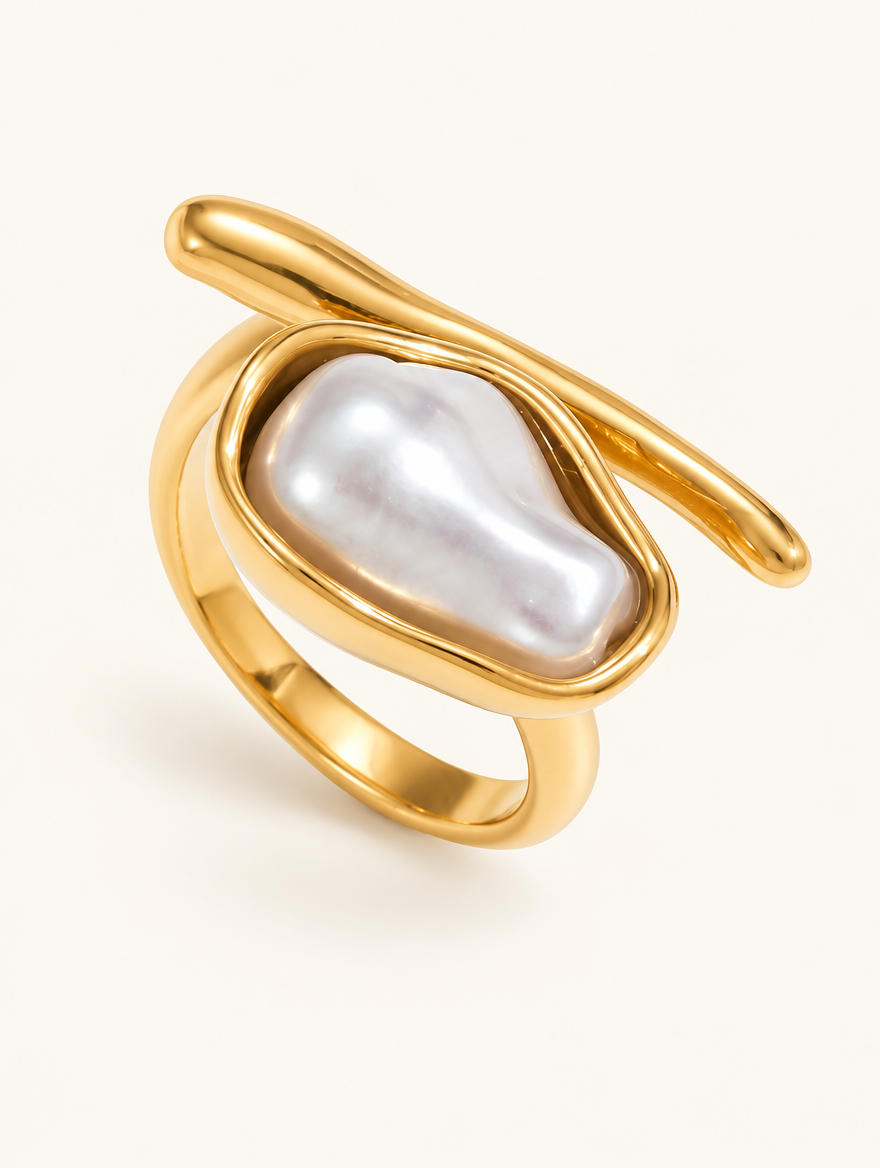 Gold baroque pearl wrap ring on a neutral background
