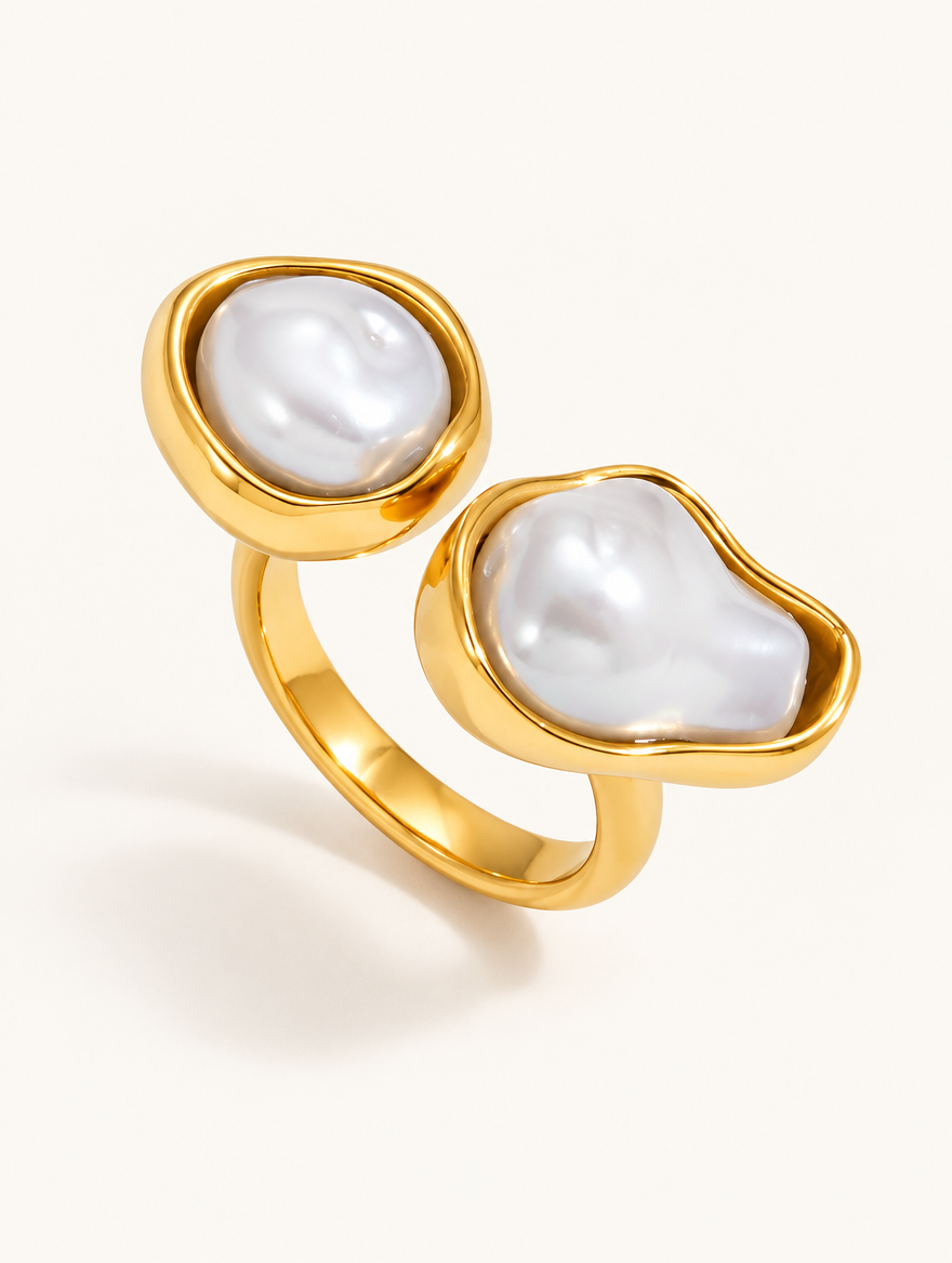 Gold double baroque pearl ring on a neutral background