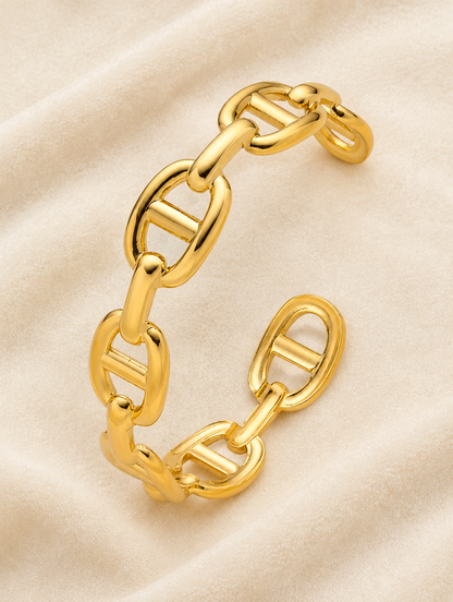 Gold mariner link cuff on cream velvet