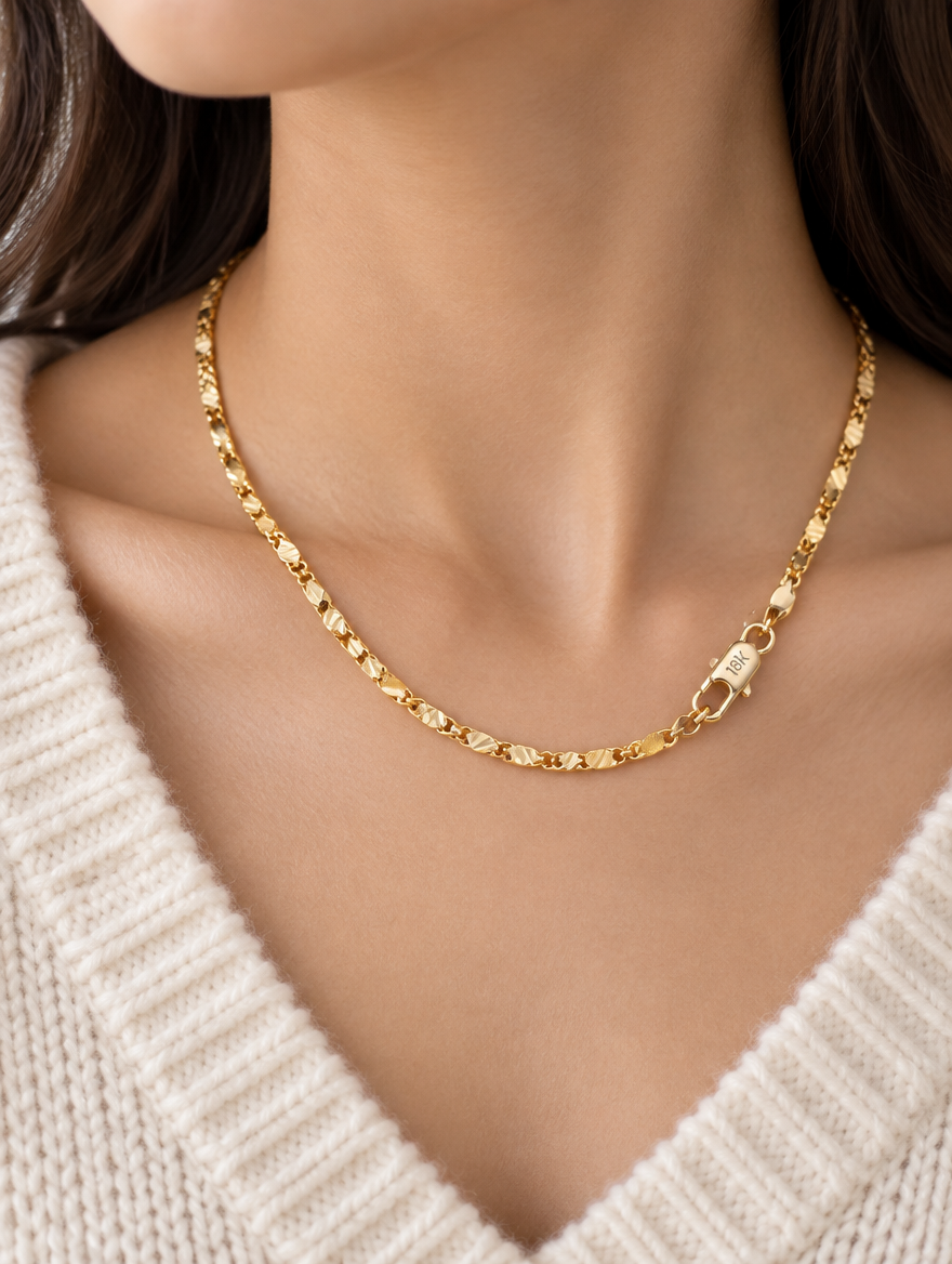 Woman wearing a gold-tone flat link side chain necklace