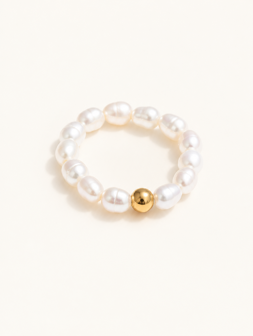Freshwater pearl beaded stretch ring on a neutral background