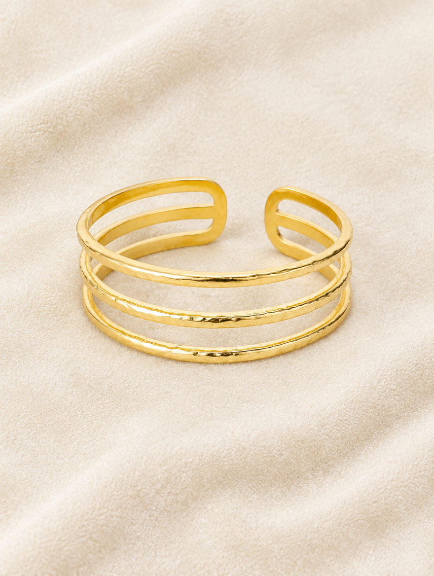 Gold triple line cuff on cream velvet