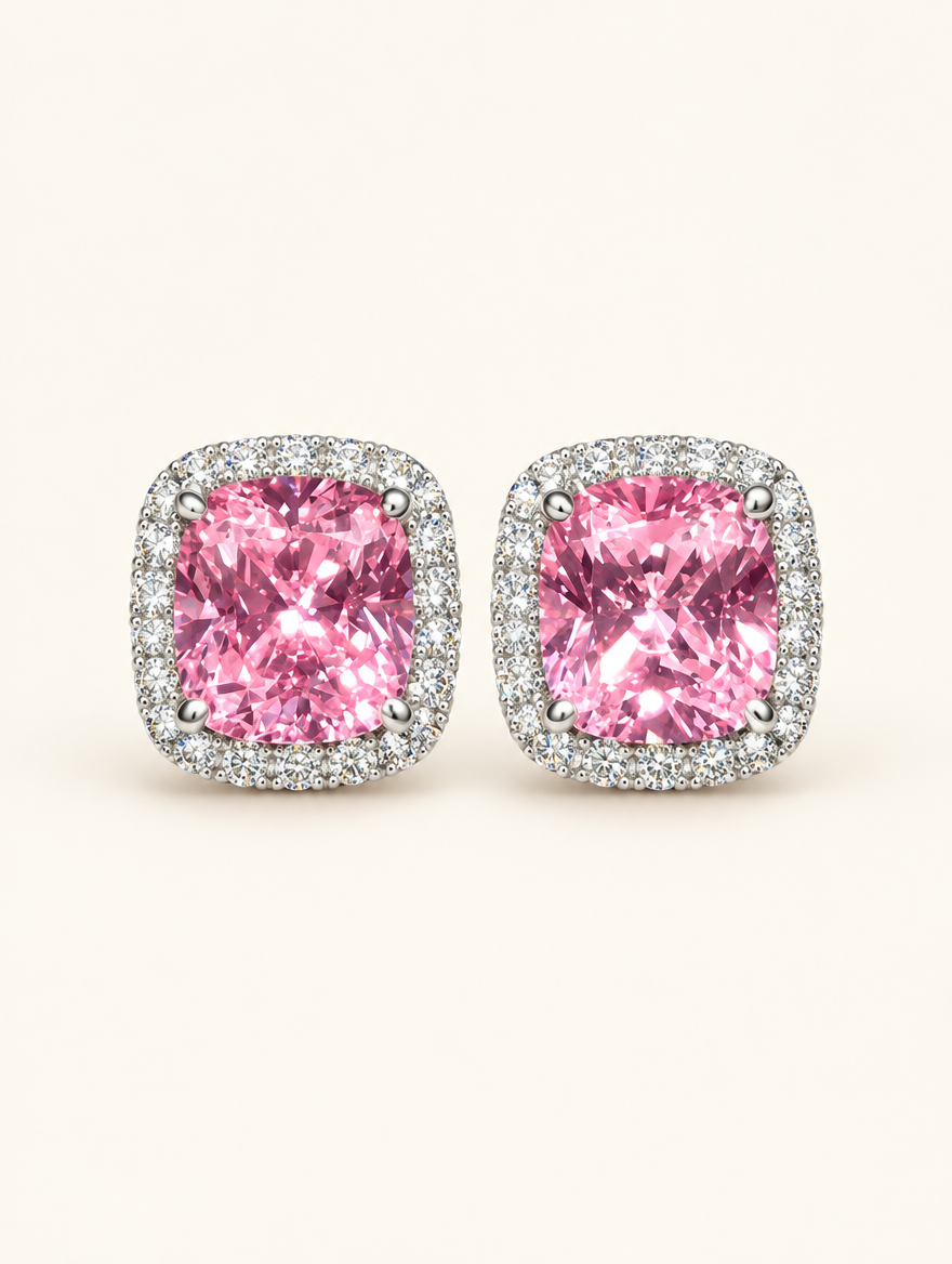 Pair of pink halo cushion-cut cz stud earrings on a warm off-white background