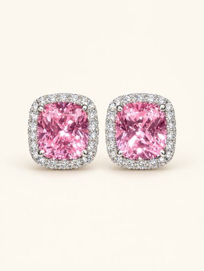 Pair of pink halo cushion-cut cz stud earrings on a warm off-white background