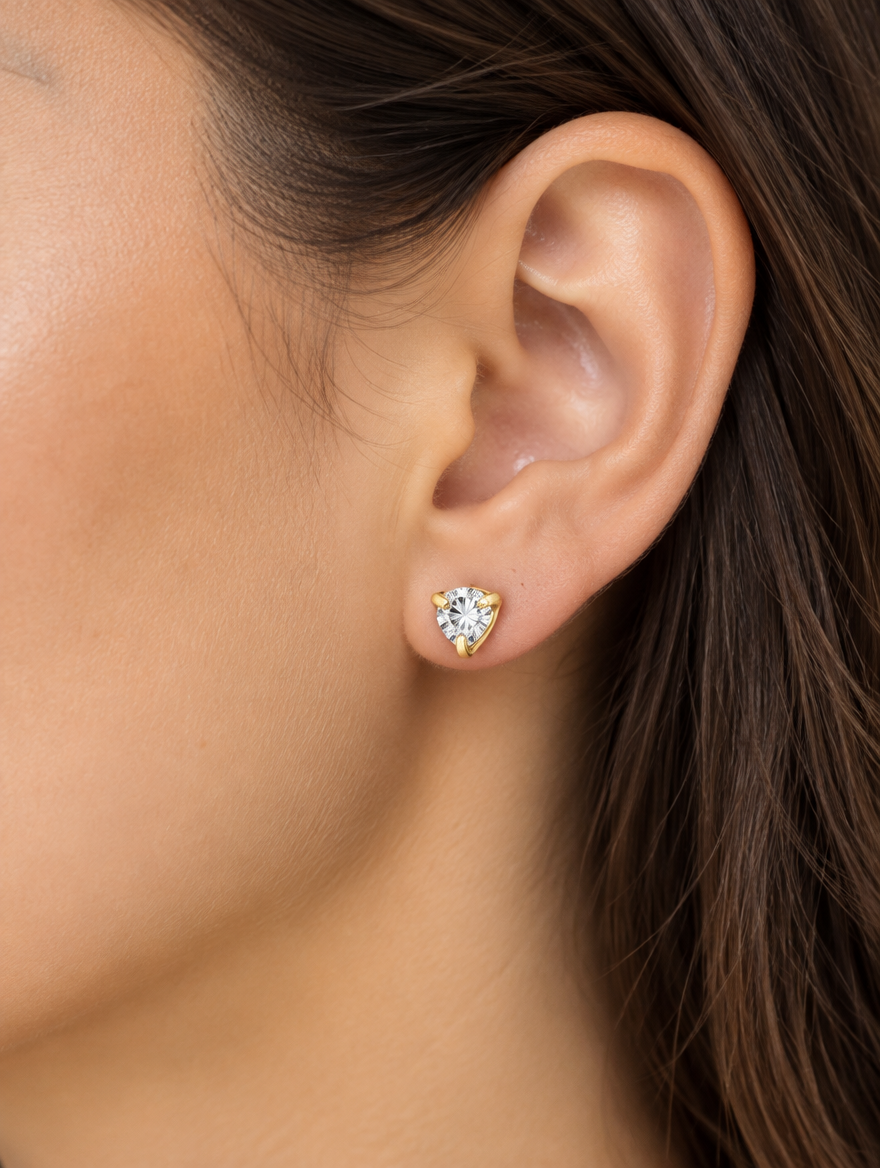 Woman wearing a gold claw-set cz stud earring