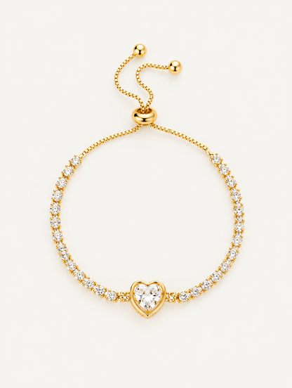 Gold heart zircon tennis bracelet on a neutral background