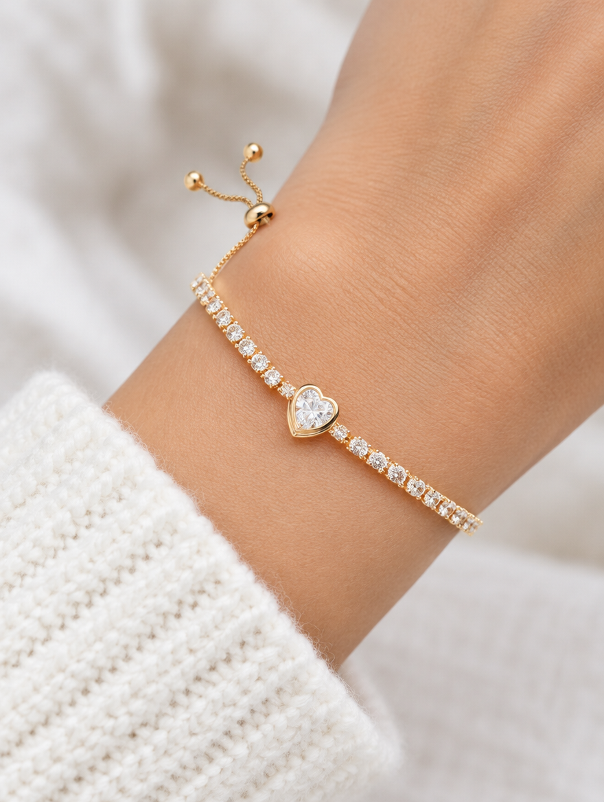 Woman wearing a gold heart zircon tennis bracelet