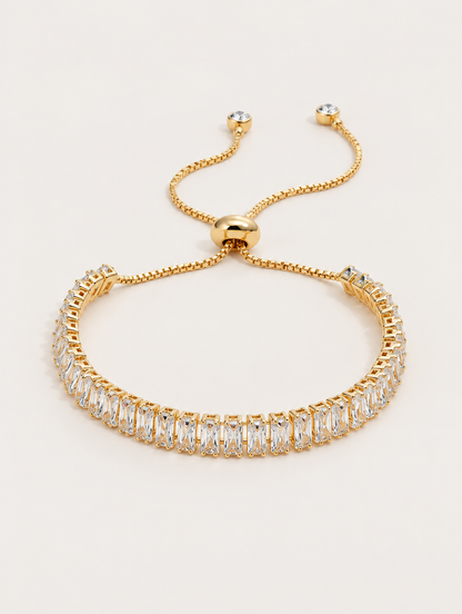 Gold baguette zircon tennis bracelet on a neutral background