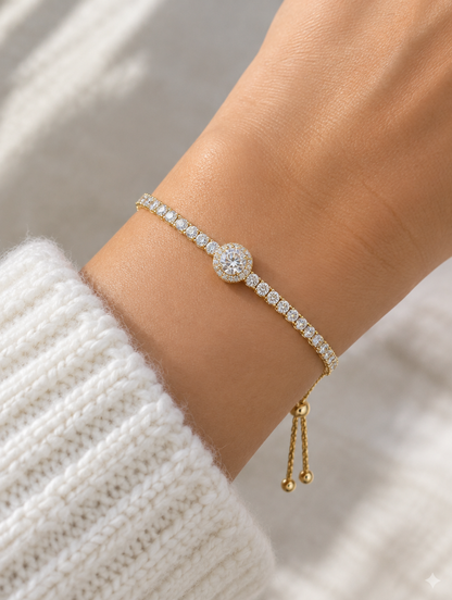Woman wearing a gold round zircon tennis bracelet
