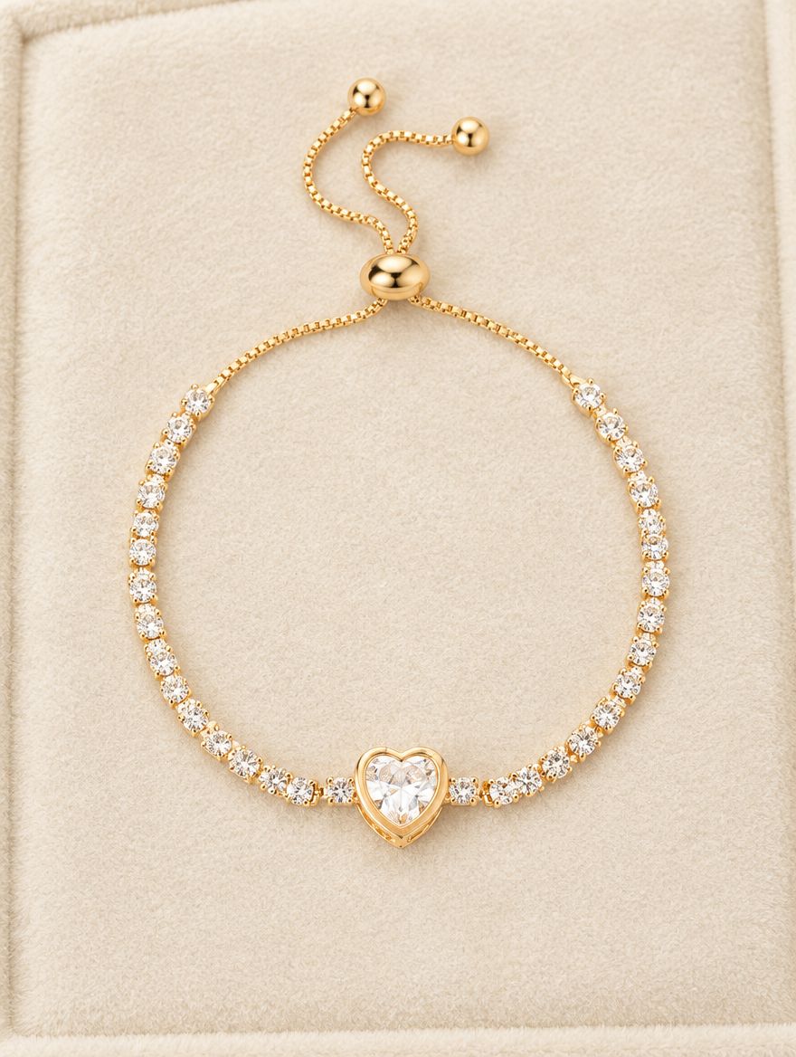 Gold heart tennis bracelet on cream velvet