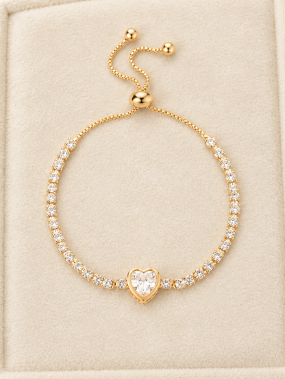 Gold heart tennis bracelet on cream velvet