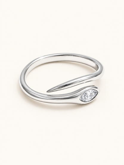 Silver snake head zirconia ring on a neutral background