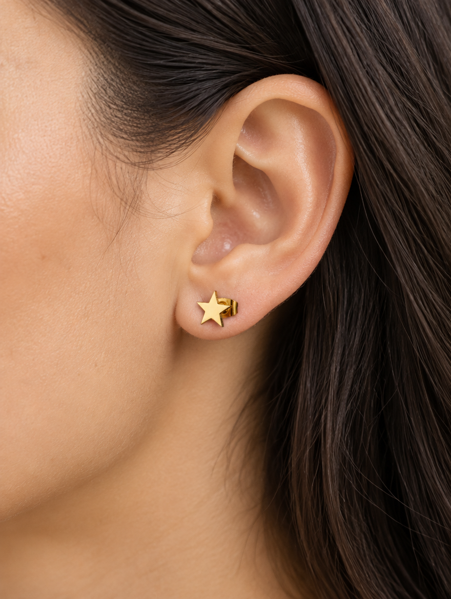 Woman wearing a gold star stud earring