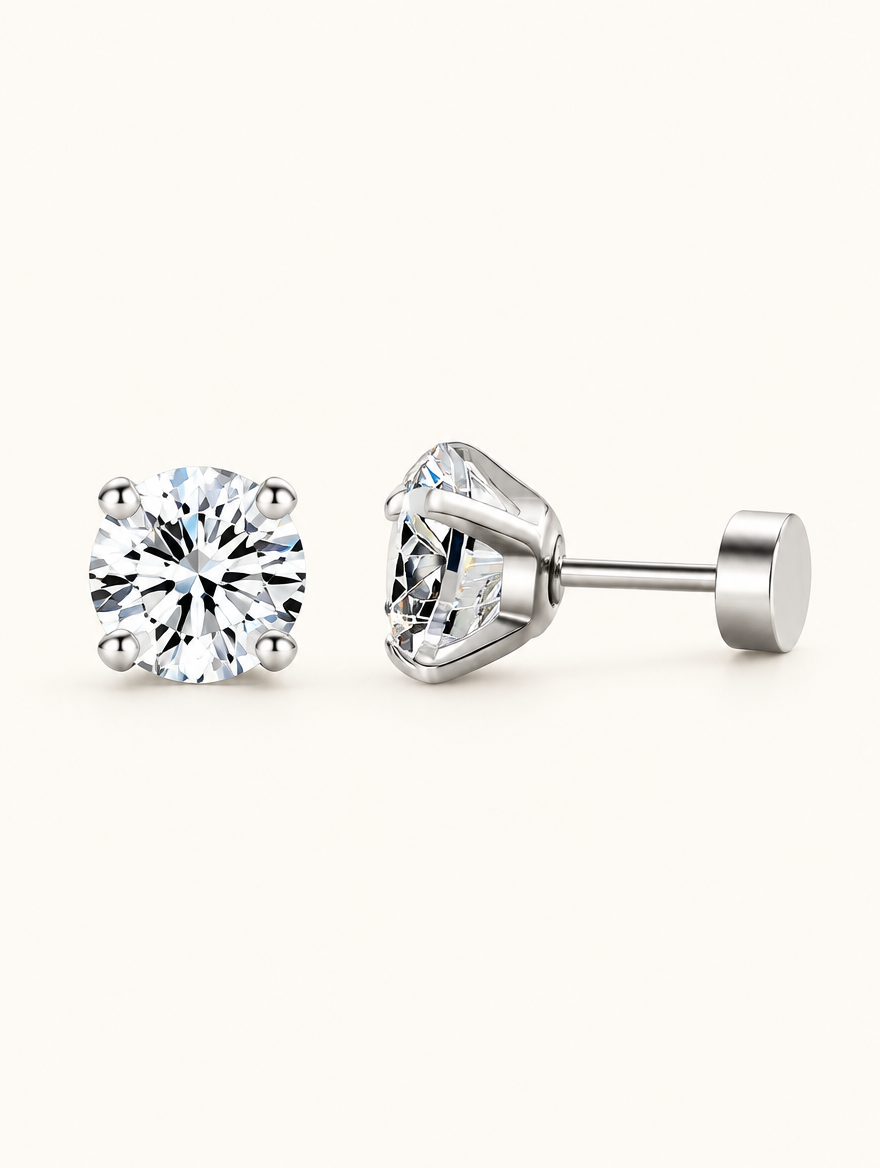Pair of silver claw-set cz stud earrings on a warm off-white background