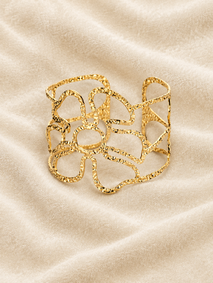 Gold wavy openwork cuff on cream velvet
