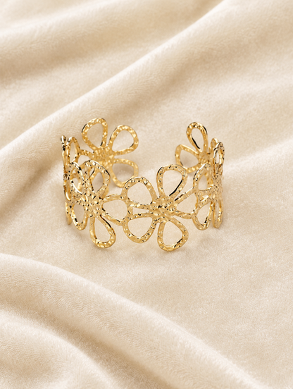 Gold outline flower cuff on cream velvet