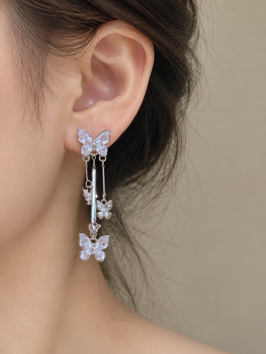Woman wearing a silver-lilac butterfly tassel drop earring