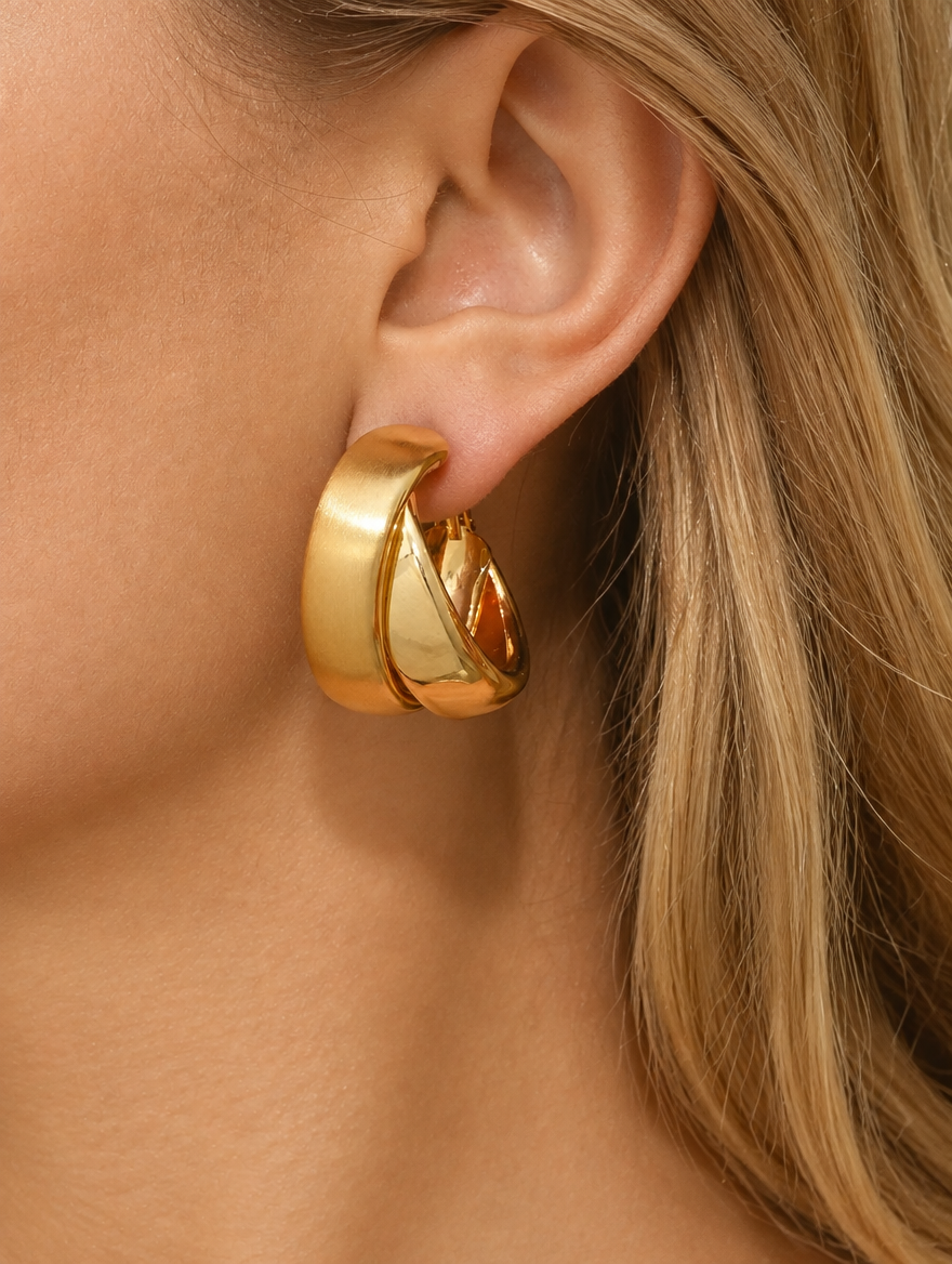 Woman wearing a chunky gold hoop earring