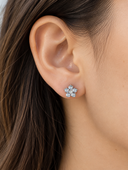 Woman wearing a titanium CZ flower stud earring