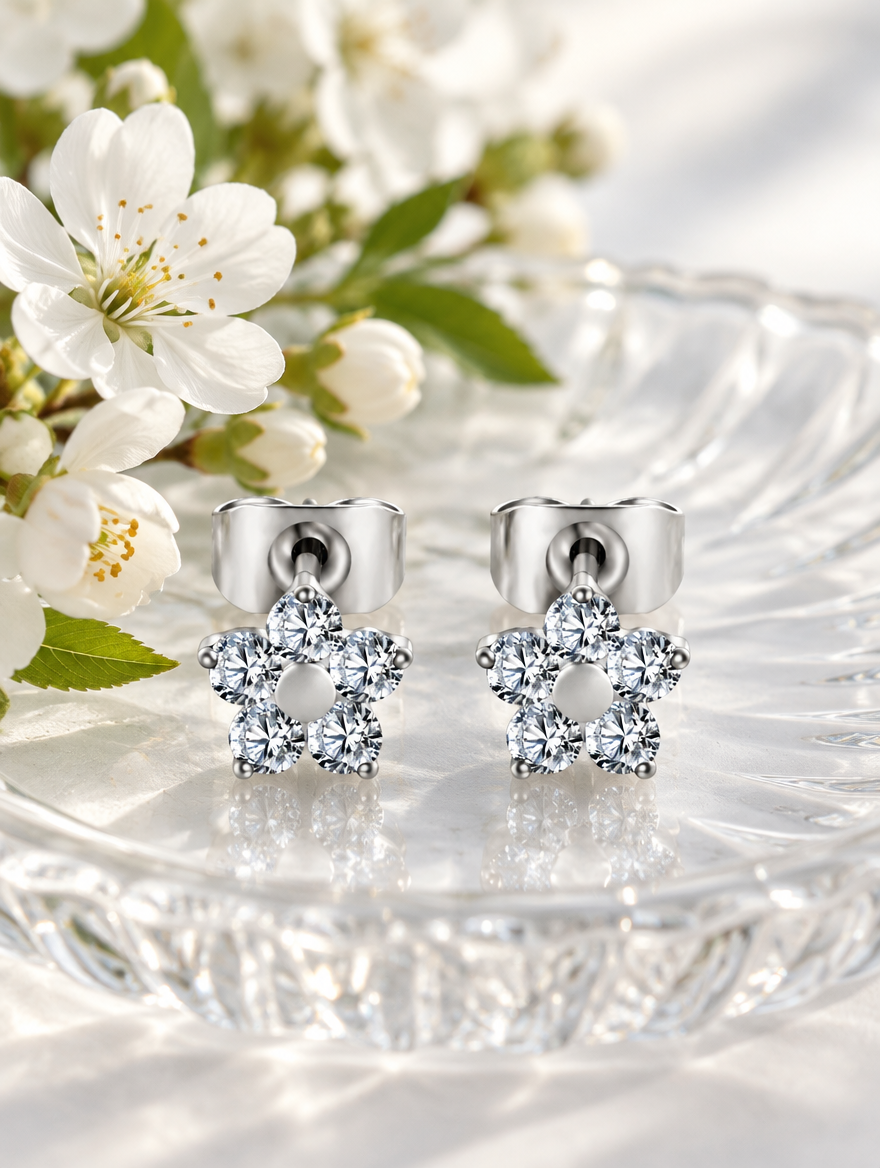 Titanium CZ flower stud earrings in a styled still life with props