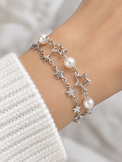 Woman wearing silver-tone star chain bracelets with faux pearls