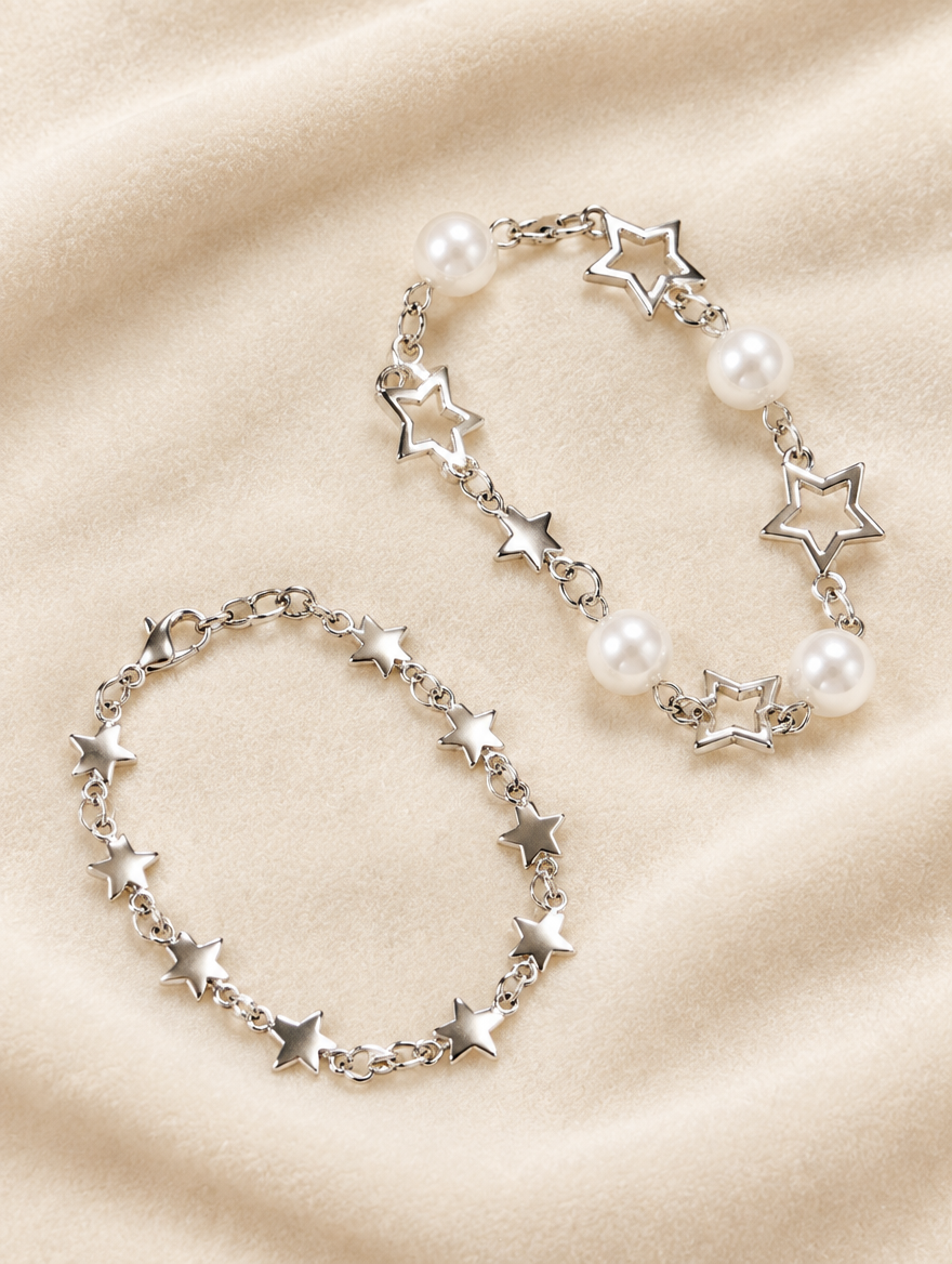 Star chain bracelets with faux pearls on cream velvet