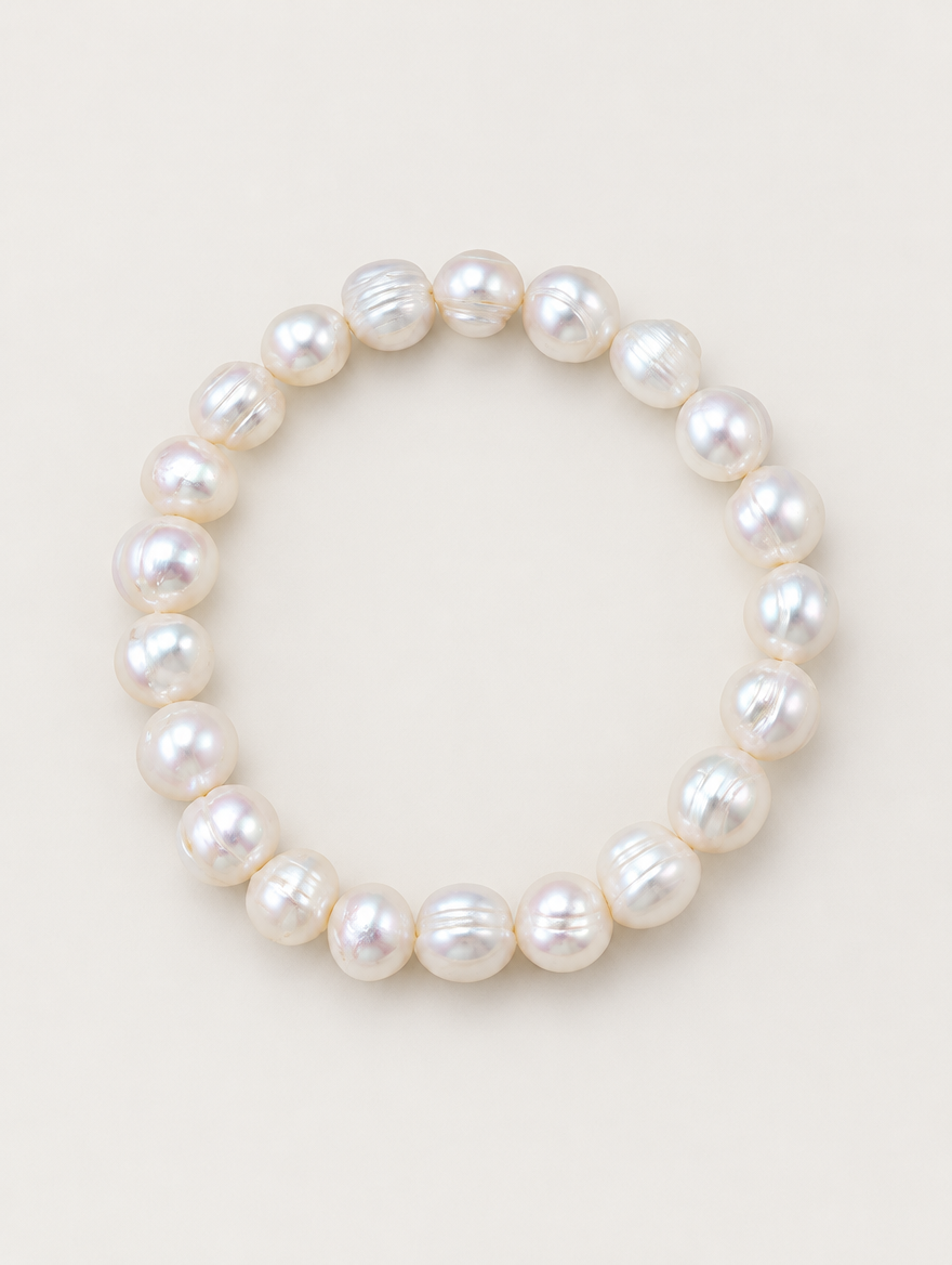 White freshwater baroque pearl bracelet on a neutral background