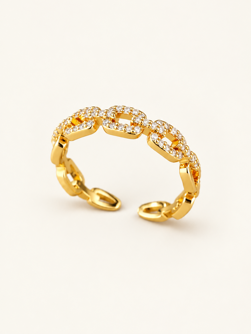 Gold slim chain link zirconia ring on a neutral background