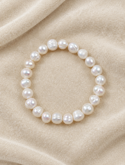 White pearl bracelet on cream velvet