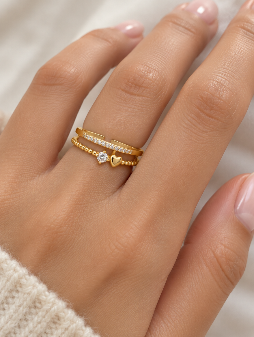 Woman wearing a gold double band heart zirconia ring on her finger