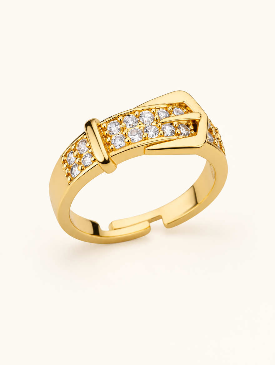 Gold belt buckle zirconia ring on a neutral background
