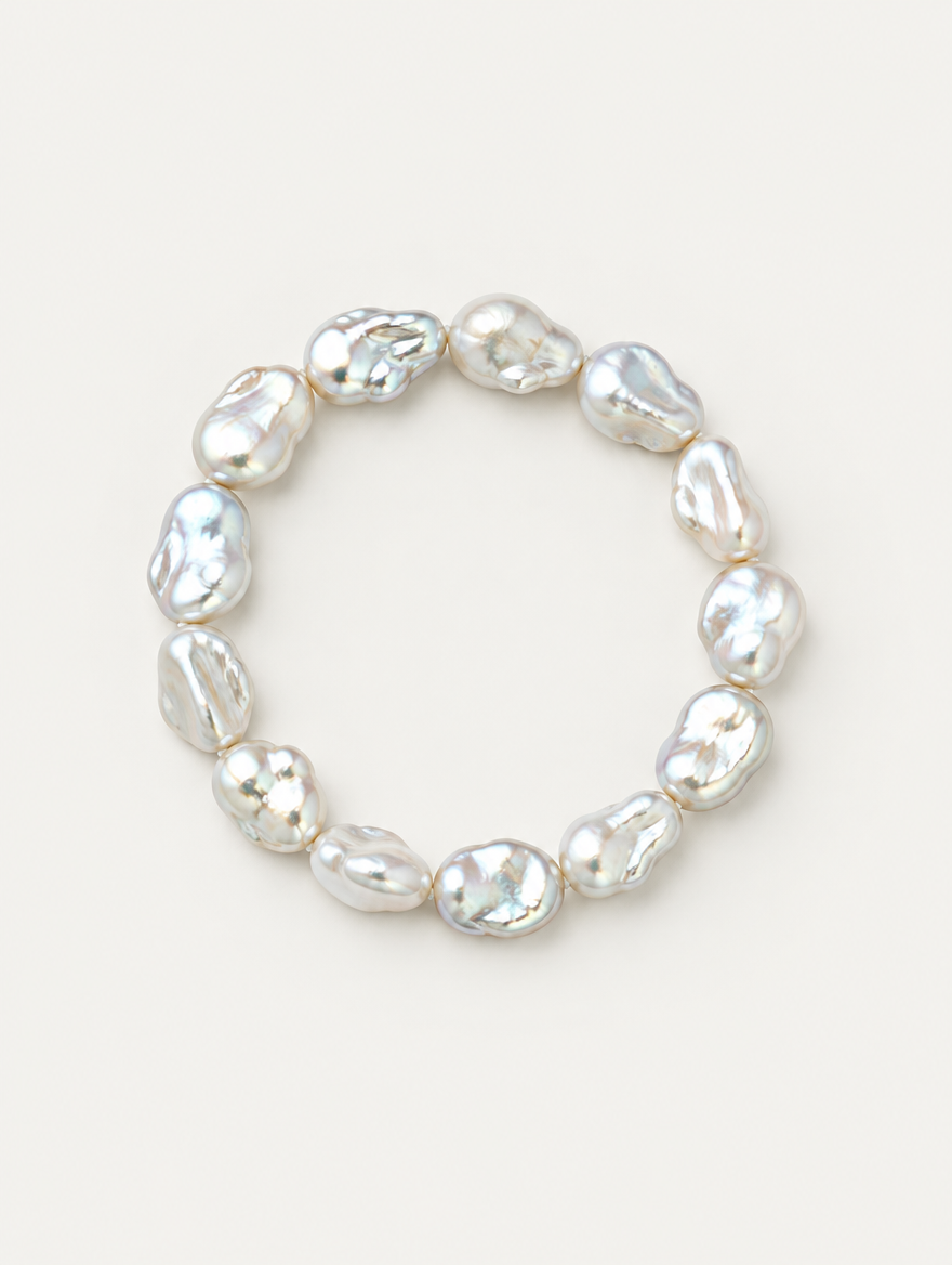 Baroque faux pearl bracelet on a neutral background