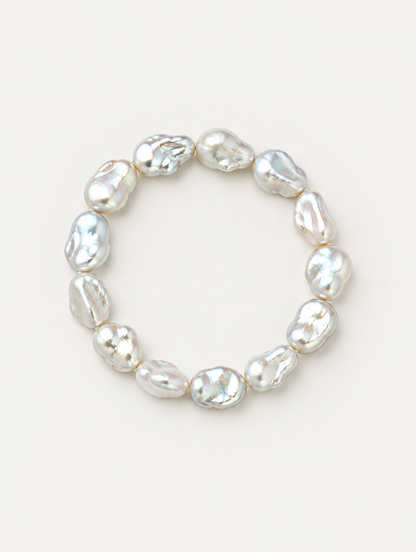 Baroque faux pearl bracelet on a neutral background