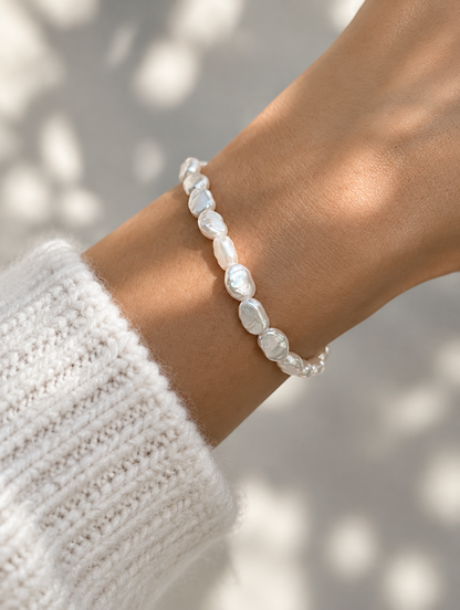 Woman wearing a baroque faux pearl bracelet