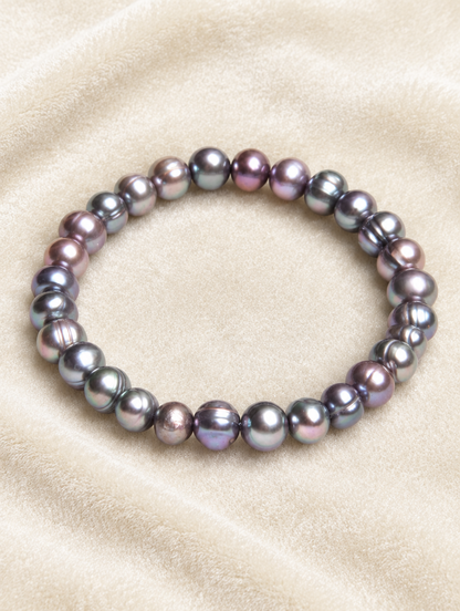 Black freshwater pearl stretch bracelet on cream velvet