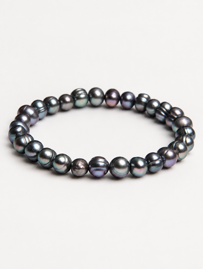 Black freshwater pearl stretch bracelet on a neutral background