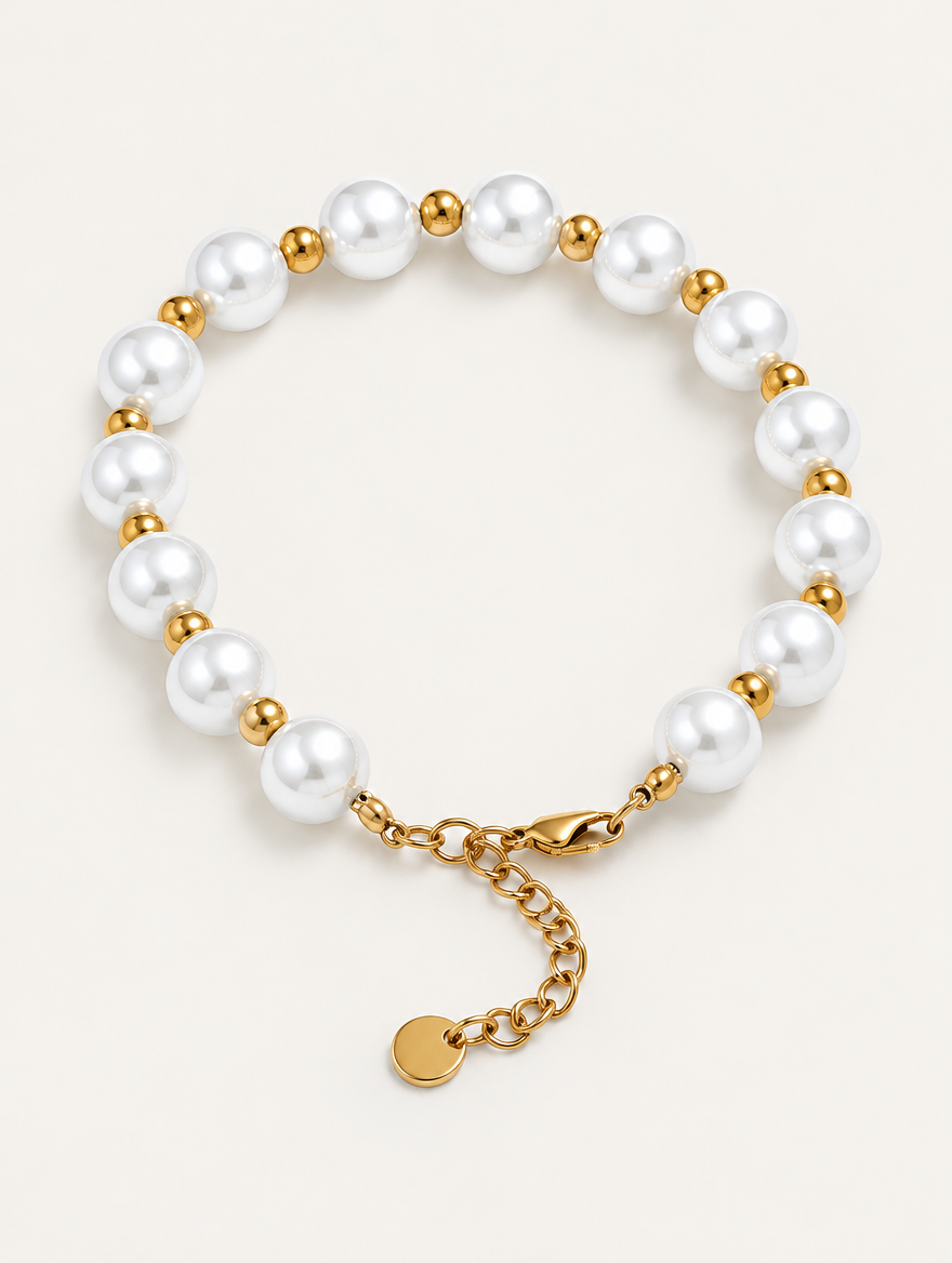 Faux pearl bracelet with gold-tone beads on a neutral background