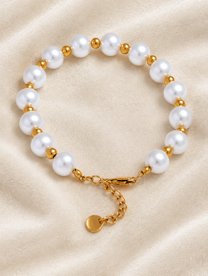 Faux pearl bracelet with gold-tone beads on cream velvet
