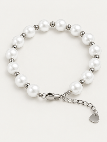 Faux pearl bracelet with silver-tone beads on a neutral background