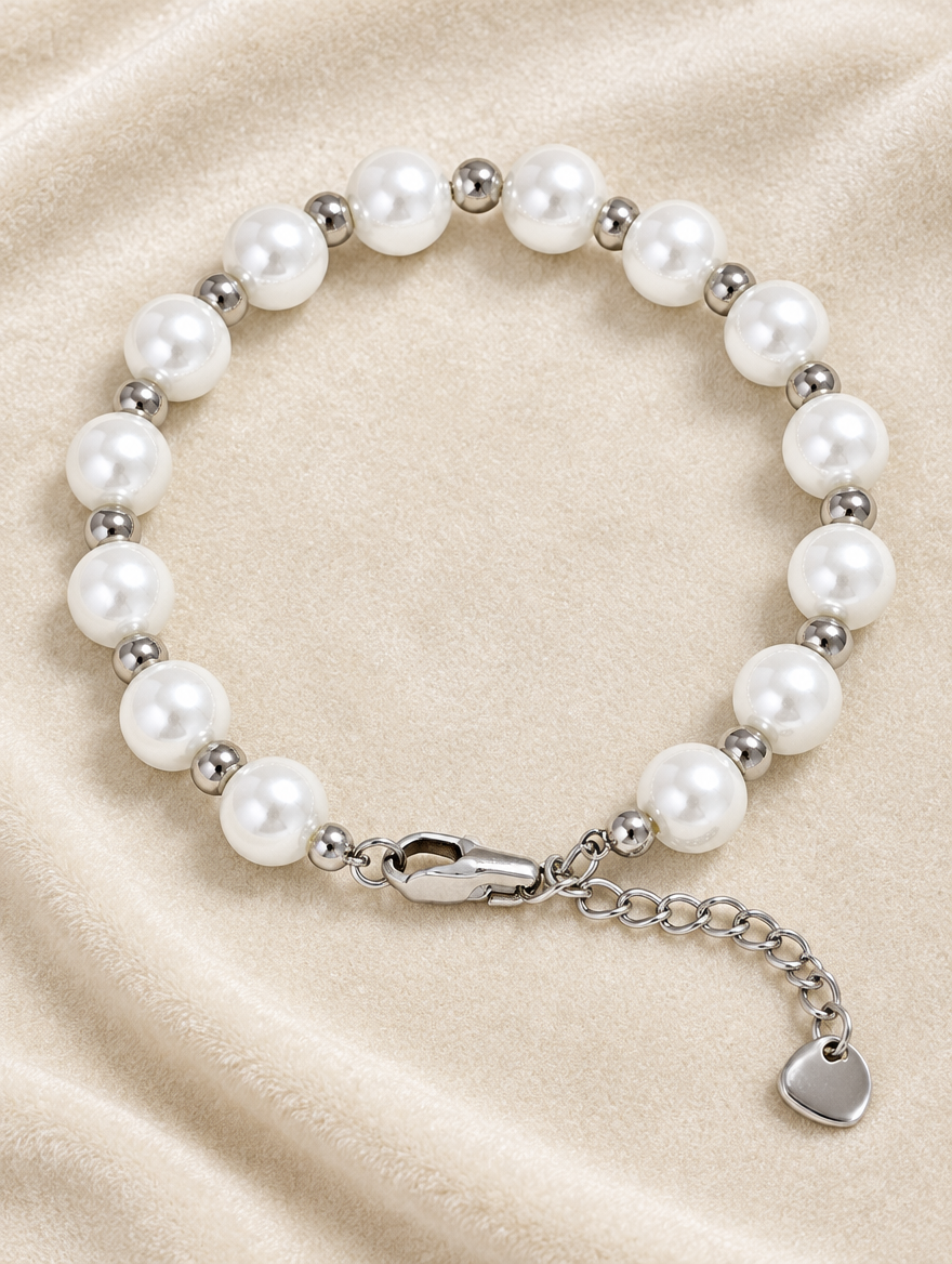 Faux pearl bracelet with silver-tone beads on cream velvet