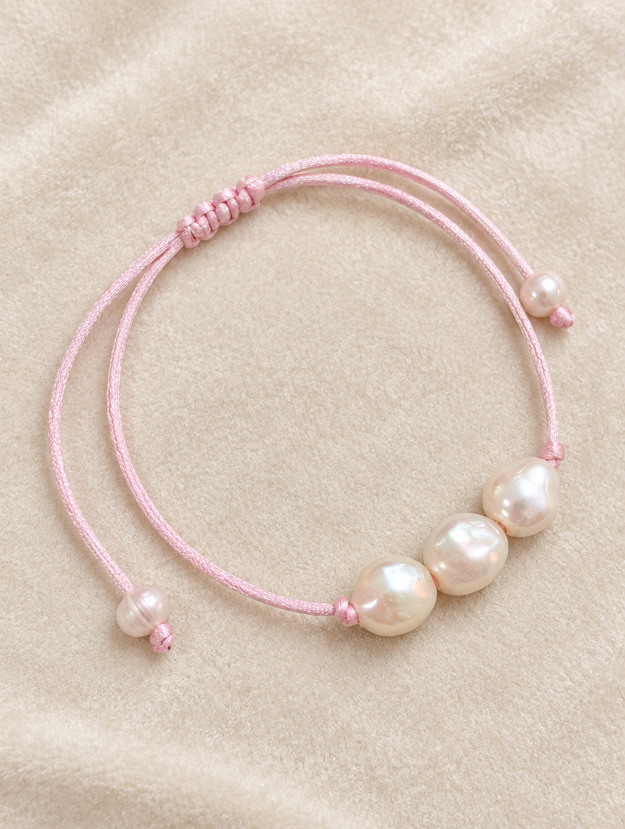 Light Pink cord bracelet with baroque freshwater pearls on cream velvet